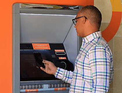 Illustration of a cardless transaction being authorised from the Sagicor Bank app
