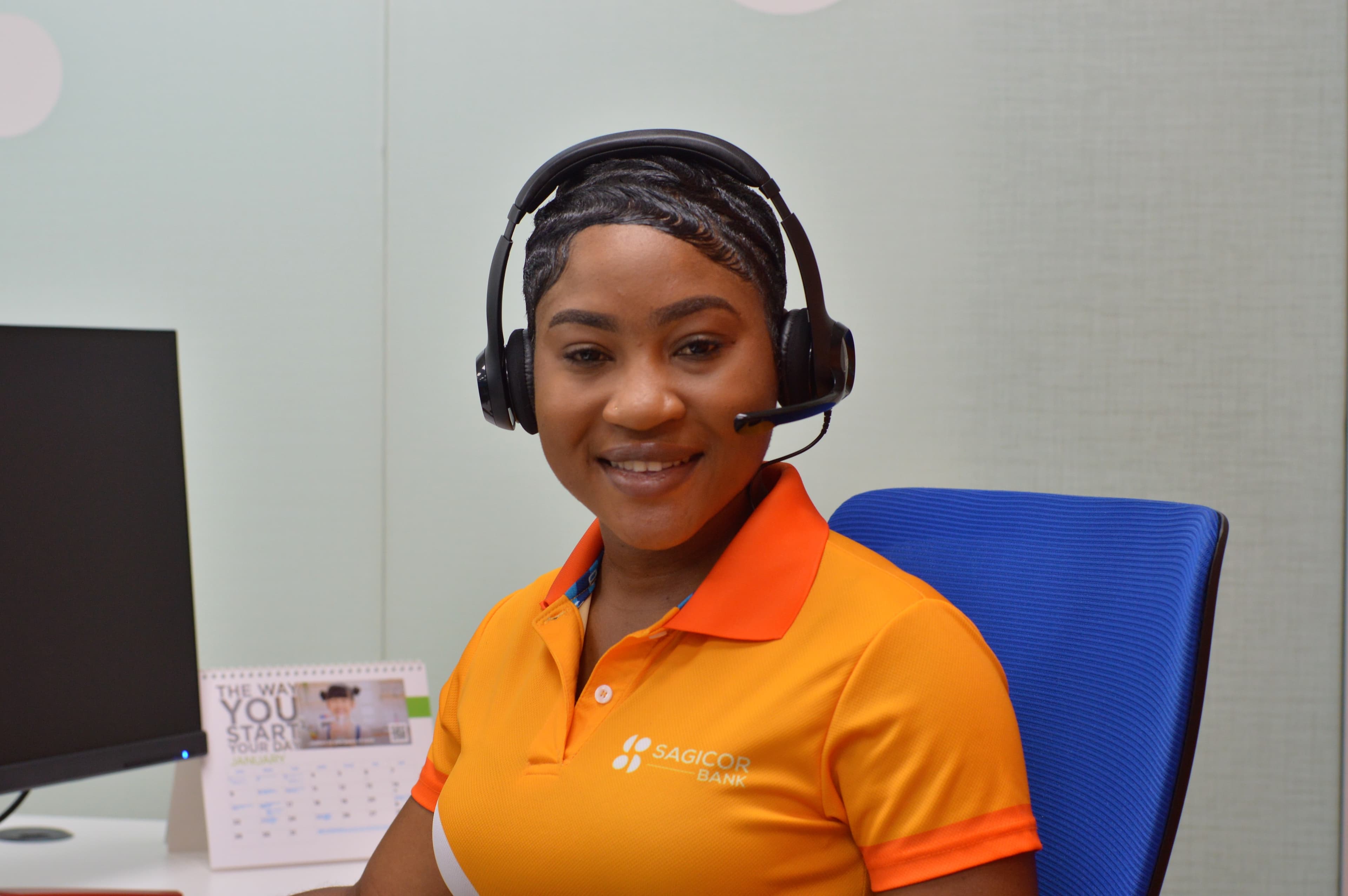 A Sagicor Bank Client Experience Centre agent wearing a headset